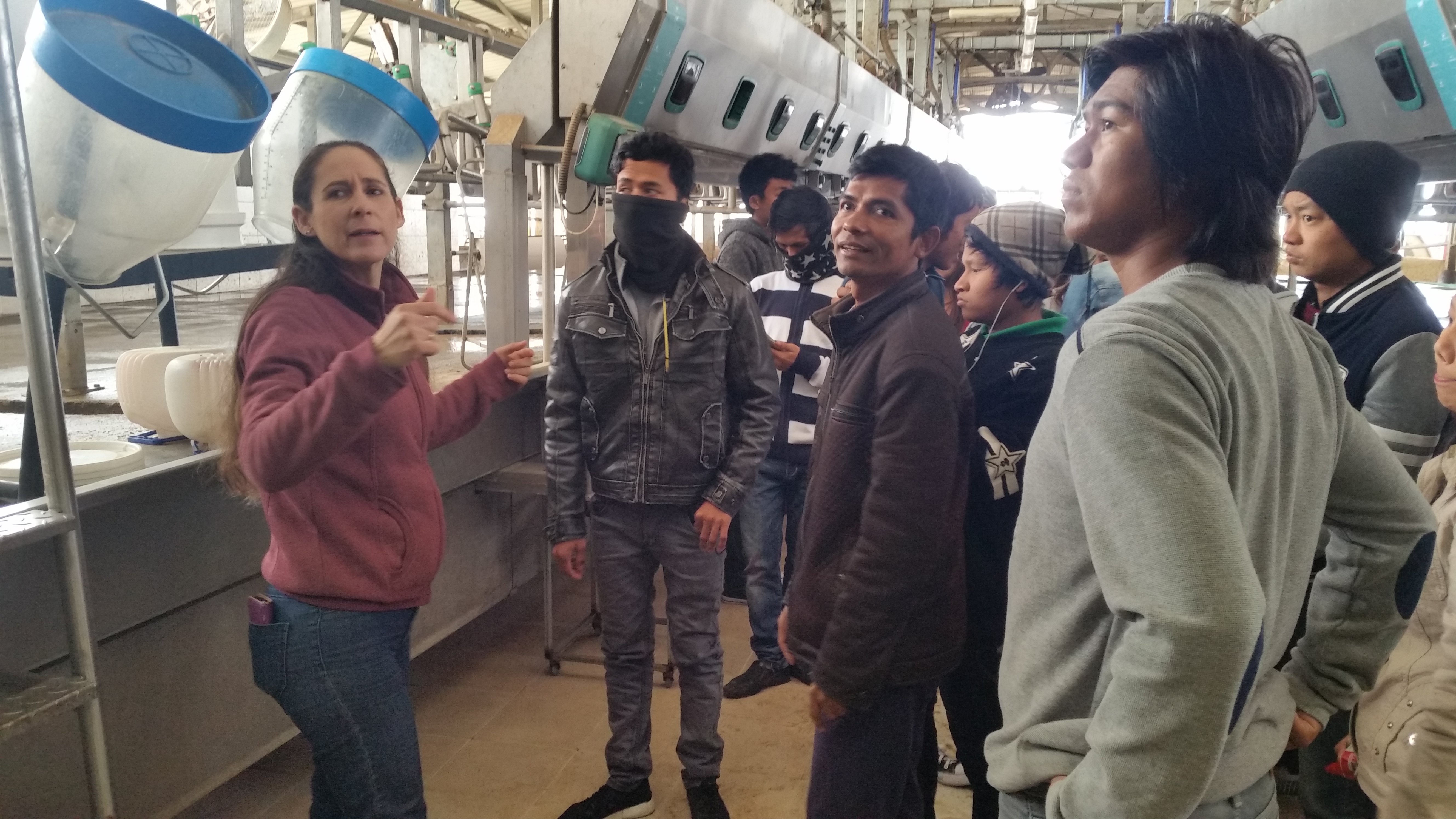 Einat with myanmar students at the dairy farm